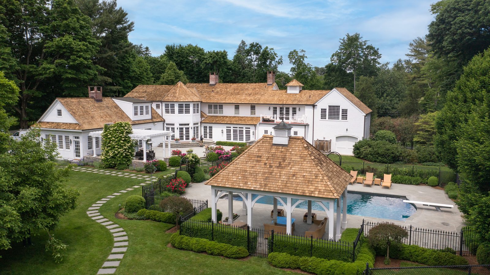 Aerial view of an estate with a pool house in Westport, Connecticut